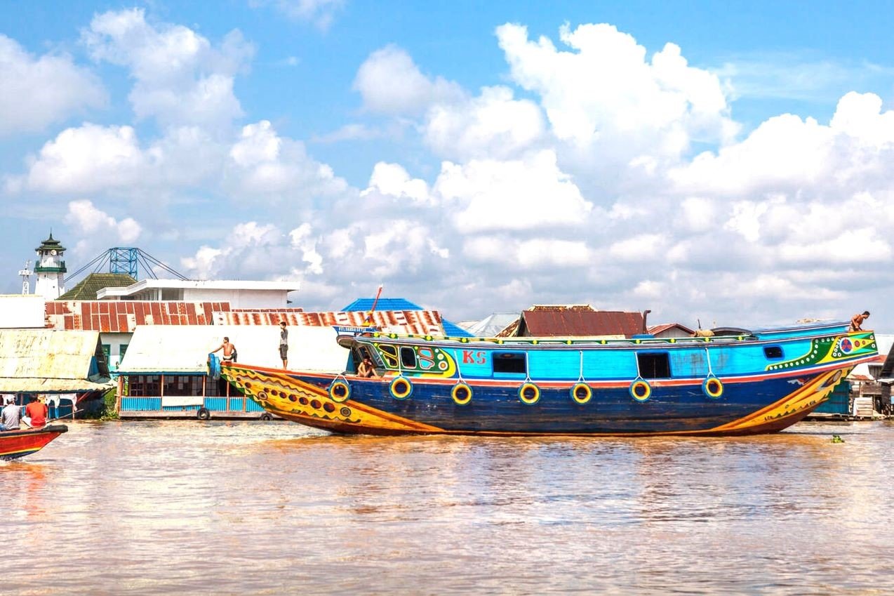 wooden boats and floating houses in musi riverbank south sumatra indonesia